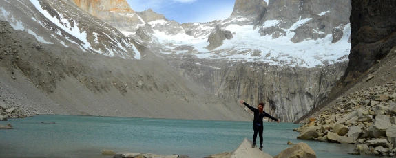 Student at the summit of Torres Del Paine in Chile